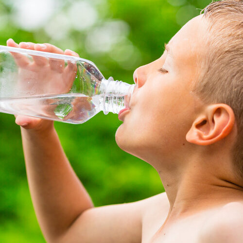 A Boy Drinks Water