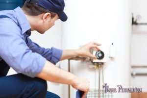 A Plumber Tests a Water Heater